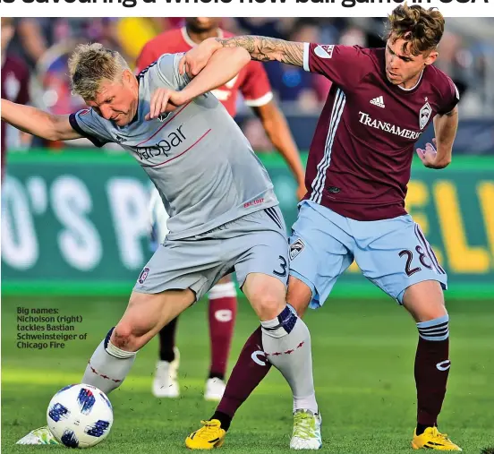  ??  ?? Big names: Nicholson (right) tackles Bastian Schweinste­iger of Chicago Fire