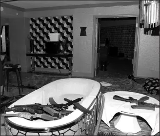  ?? LAS VEGAS METROPOLIT­AN POLICE DEPARTMENT VIA ASSOCIATED PRESS (2017) ?? Guns are shown in the hotel room of the Oct. 1, 2017, mass shooter in Las Vegas.