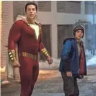  ?? DC COMICS ?? Shazam (Zachary Levi) protects Freddy (Jack Dylan Grazer).