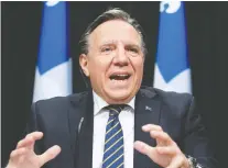  ?? JACQUES BOISSINOT/ THE CANADIAN PRESS FILES ?? Polls show Quebecers still back the CAQ government's actions and Premier François Legault's “bon père-de-famille” leadership approach, despite the COVID-19 death toll.