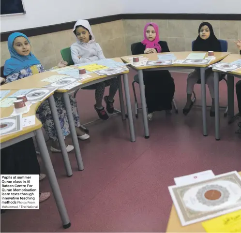  ?? Photos Reem Mohammed / The National ?? Pupils at summer Quran class in Al Bateen Centre For Quran Memorisati­on learn texts through innovative teaching methods