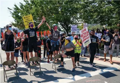  ?? Photograph: Toni L. Sandys/The Washington Post via Getty Images ?? People protest against constructi­on of a self-storage facility in Bethesda, Maryland, on 4 September 2020, on the site.
