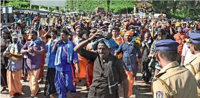  ?? PTI ?? devotees trek from the nilakkal base camp towards the Sabarimala temple in Pathanamth­itta on Monday. this is the second time the hill temple opened after the Supreme Court allowed entry of women of all age groups. —