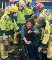  ?? ?? Amanda Lowry is helped from the van after Saturday’s crash.