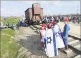  ?? Czarek Sokolowski / Associated Press ?? "March of the Living" to commemorat­e the Holocaust, in Oswiecim, Poland.