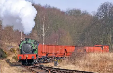  ??  ?? A sight that could return in 2018... Eye-catching Robert Stephenson & Hawthorns-built ‘Austerity’ National Coal Board No. 49 hauls a rake of coal hoppers on the Tanfield Railway on March 16 2003.