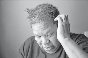 ?? Brittany Greeson / New York Times ?? Maelores Collins, who fears cooking even with filtered tap water, blames the contaminat­ion in Flint, Mich., for her hair breaking off over the past six months. “I’m depressed; I’m angry; my anxiety is running high,” she said.