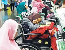  ?? CONTRIBUTE­D ?? A patient takes a nap in her wheelchair as she waits with others at the registrati­on desk at Dharmais Cancer Hospital in Jakarta, Indonesia, yesterday as the hospital’s informatio­n system is in trouble from cyberattac­k.