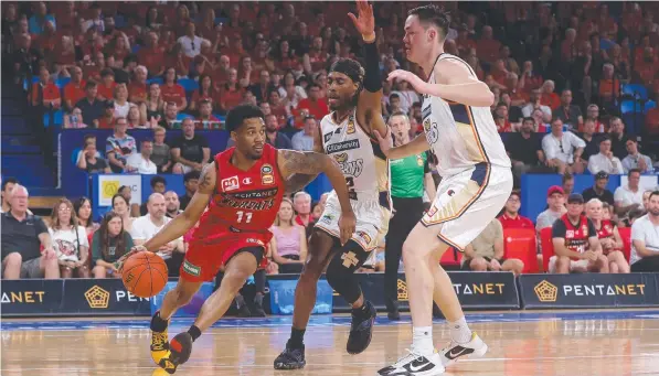  ?? Picture: Paul Kane/Getty Images ?? Three-time MVP and Perth Wildcats star Bryce Cotton navigates his way past the brittle Taipans defence.