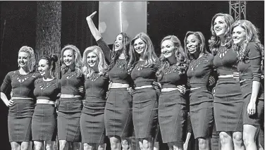  ?? Arkansas Democrat-Gazette/MITCHELL PE MASILUN ?? The 10 finalists for the 2017 Miss Arkansas crown greet the crowd Saturday night at Robinson Center in Little Rock.