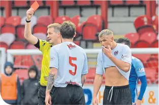  ??  ?? Tom Lang (Clyde) in sent off against Peterhead