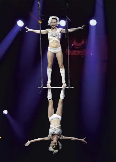  ?? CHRIS SWEDA/CHICAGO TRIBUNE PHOTOS ?? Alla Chebanova, top, and Kateryna Lunhu, of Troup Bingo from Ukraine, perform at Circus Vazquez outside of Woodfield Mall in Schaumburg on April 22.