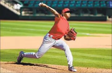  ?? Abbie Parr Getty Images ?? RAISEL IGLESIAS pitches in the eighth inning of a spring game for the Angels. Iglesias, one of five closers with 100 saves or more since the start of the 2017 season, has a 9.00 ERA over four games this season.