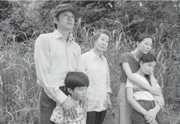  ??  ?? Steven Yeun, from left, Alan Kim, Yuh-Jung Youn, Yeri Han and Noel Cho in Lee Isaac Chung’s “Minari.” JOSH ETHAN JOHNSON/A24