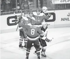  ?? AL DRAGO/ASSOCIATED PRESS ?? Capitals center Nicklas Backstrom celebrates his goal with defenseman John Carlson (74), right wing Tom Wilson (43) and left wing Alex Ovechkin (8).