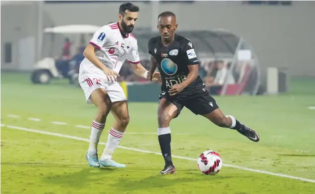  ?? ?? ↑
Players of Sharjah and Bani Yas in action during their ADIB Cup match on Saturday.