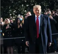  ?? DREW ANGERER/GETTY IMAGES ?? President Donald Trump turns to reporters as he exits the White House on Tuesday in Washington, D.C.