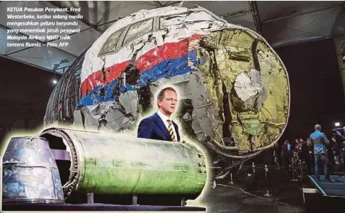  ??  ?? KETUA Pasukan Penyiasat, Fred Westerbeke, ketika sidang media mengesahka­n peluru berpandu yang menembak jatuh pesawat Malaysia Airlines MH17 milik tentera Russia. - Foto AFP