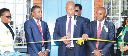  ??  ?? Finance and Economic Developmen­t Minister Patrick Chinamasa (centre) officially opens the new Insurance Council of Zimbabwe offices in Harare yesterday