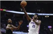  ?? RON SCHWANE – THE ASSOCIATED PRESS ?? Philadelph­ia center Joel Embiid (21) had 36 points and 18 rebounds in the 76ers’ victory at Cleveland on Wednesday.