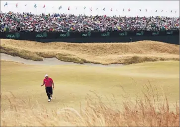  ?? Charlie Riedel Associated Press ?? PATRICK REED LEAVES No. 18 on Thursday, when it was a par- f ive. It will be a par- four today.