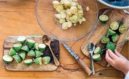  ??  ?? The feijoa flesh is easy to scoop out once the fruit is cut in half.