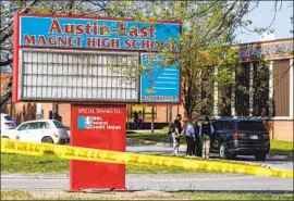  ?? Wade Payne Associated Press ?? A STUDENT opened fire on officers at Austin-East Magnet High School in Knoxville, Tenn., and police killed him, authoritie­s say. An officer was wounded.