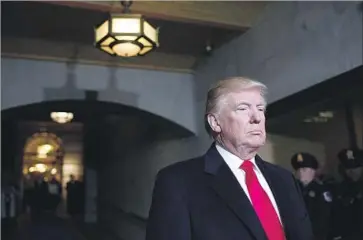  ?? Win McNamee Associated Press ?? BEFORE TAKING THE OATH of office Friday, Donald Trump waits at the West Front of the U.S. Capitol.