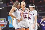  ?? DAVID BECKER / ASSOCIATED PRESS ?? Gonzaga forward Yvonne Ejim (15), forward Eliza Hollingswo­rth (12) and guard Kaylynne Truong (14) huddle during a time out during the 2023 West Coast Conference women’s tournament in Las Vegas.