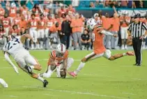  ?? MICHAEL LAUGHLIN/SOUTH FLORIDA SUN SENTINEL ?? The Hurricanes’ Andres Borregales kicks the ball at the end of a game against Virginia.