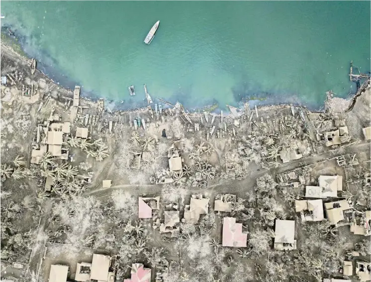  ??  ?? Grey coast: An aerial view showing buildings covered in ash from the eruption of the Taal volcano in the village of Buso Buso, near Laurel, Batangas.