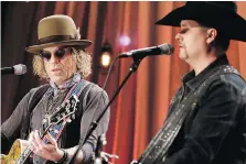  ??  ?? “I think if a man has ill will in his heart, then there’s weapons everywhere,” says Big Kenny, left, of the country duo Big & Rich.