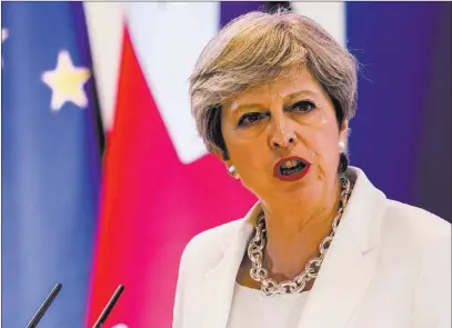  ?? Geert Vanden Wijngaert ?? British Prime Minister Theresa May speaks during a media conference Friday at an EU summit in Brussels. The Associated Press