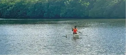  ?? ?? Fishing canoe out on the waters for testing.