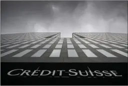  ?? ENNIO LEANZA — KEYSTONE VIA AP, FILE ?? Grey clouds cover the sky over a building of the Credit Suisse bank in Zurich, Switzerlan­d, on Feb. 21.