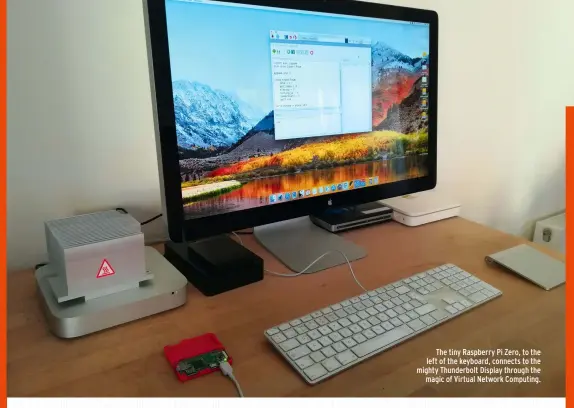  ??  ?? The tiny Raspberry Pi Zero, to the left of the keyboard, connects to the mighty Thunderbol­t Display through the magic of Virtual Network Computing.