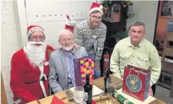  ??  ?? Guests at the 2015 Christmas Day dinner held at Amlwch’s Sail Loft. Persents were even donated