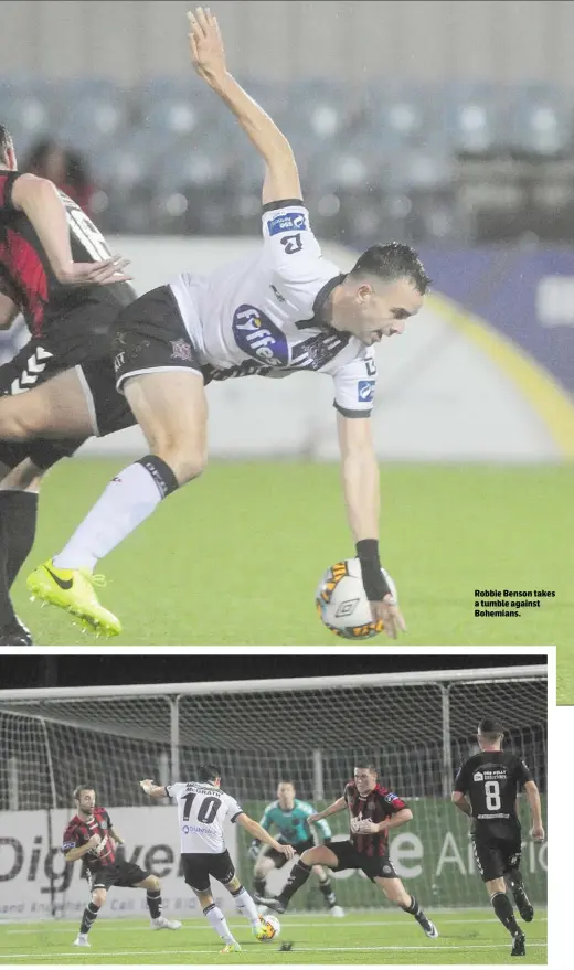  ??  ?? Jamie McGrath attempts a shot at goal during the Premier Division game in Oriel Park on Friday night. Robbie Benson takes a tumble against Bohemians.