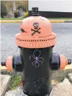  ??  ?? Anne and Campbell Kukitz painted this Emmaus hydrant at Keystone Avenue and Ridge Street in tribute to the Halloween parade.