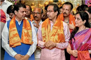  ?? KUNAL PATIL/GETTY IMAGES ?? WILL THEY, WON’T THEY? Maharashtr­a chief minister Devendra Fadnavis with Shiv Sena chief Uddhav Thackeray