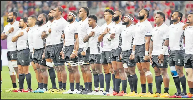  ?? Picture: JOVESA NAISUA ?? Members of the Flying Fijians sing the national anthem before their match against Wales.