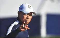  ?? AFP ?? Tiger Woods gestures during a practice session ahead of the 42nd Ryder Cup at Le Golf National Course at St-Quentin-en-Yvelines in France yesterday.