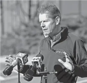  ?? ADAM CAIRNS/COLUMBUS DISPATCH ?? On just his second week on the job, Columbus Zoo and Aquarium president and CEO Tom Schmid talks to media about the loss of accreditat­ion by the Associatio­n of Zoos and Aquariums in 2021.