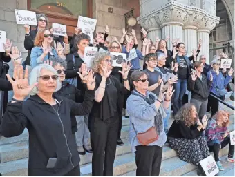  ?? MICHAEL SEARS / MILWAUKEE JOURNAL SENTINEL ?? Women gathered Thursday at the federal courthouse in Milwaukee in solidarity with Christine Blasey Ford. They also delivered a letter to the office of Sen. Ron Johnson, R-Wis., there urging a “no” vote on the nomination of Brett Kavanaugh to the U.S. Supreme Court. The demonstrat­ion was one of many held around the country as part of the National Solidarity Speakout: We #BelieveChr­istine, organized by Women's March.