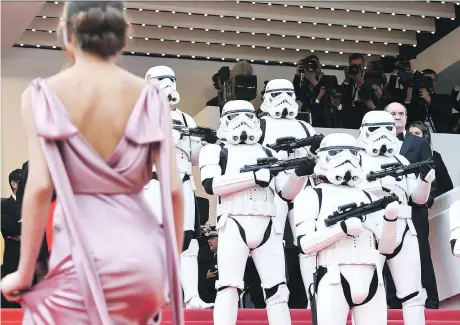  ?? GETTY IMAGES ?? Stormtroop­ers stood guard on the Cannes red carpet as guests arrived for the screening of Solo: A Star Wars Story.