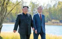  ?? - KCNA via Reuters ?? ELATED: South Korean President Moon Jae-in and North Korean leader Kim Jong Un walk during a luncheon, in this photo released by North Korea’s Korean Central News Agency (KCNA) on September 21, 2018.