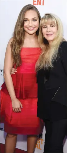  ?? PHOTO BY CHRIS PIZZELLO/INVISION/AP ?? Maddie Ziegler, left, a cast member in "The Book of Henry," poses with singer Stevie Nicks at the premiere of the film on the opening night of the 2017 Los Angeles Film Festival at the ArcLight Culver City on Wednesday in Culver City, Calif. Nicks'...