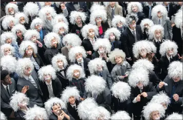  ?? PICTURE: REUTERS ?? Some of the 404 participan­ts pose for a photo yesterday during the ‘Next Einstein’ competitio­n, which set a Guinness World Record for the ‘largest gathering of people dressed as Albert Einstein’, according to organisers of the Einstein Legacy Project,...