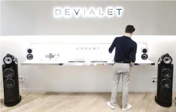  ?? — Bloomberg photo by Marlene Awaad. ?? An employee tests equipment inside the Devialet SAS Analogue Digital Hybrid amplificat­ion technology showroom in Paris.