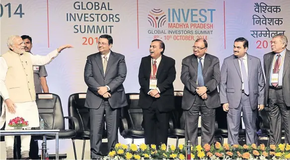  ??  ?? Prime Minister Narendra Modi introduces some of India’s top business executives including his old friend Gautam Adani (second from right) at the Global Investors Summit 2014 in Madhya Pradesh in October last year.